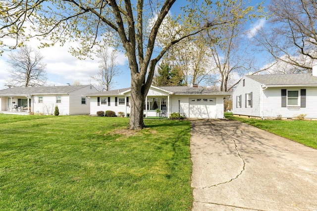 ranch-style home with an attached garage, driveway, and a front lawn