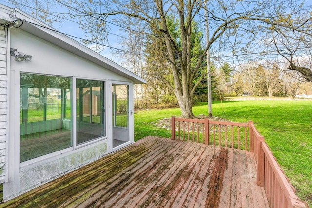 deck featuring a lawn