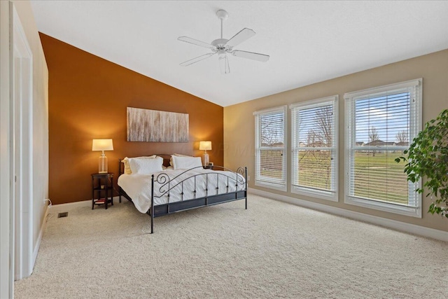 carpeted bedroom featuring ceiling fan and lofted ceiling