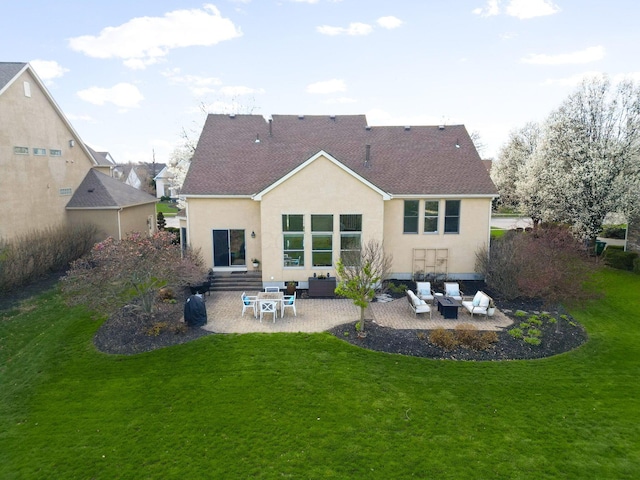 back of property with a yard, entry steps, outdoor lounge area, a patio, and stucco siding