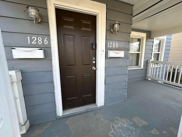 doorway to property with covered porch