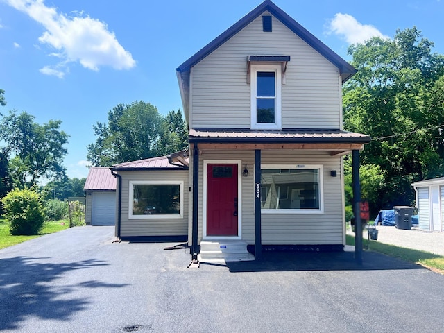 534 Carpenter St, Lancaster, OH 43130 - traditional-style house with entry steps and a metal roof