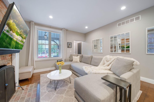 62 Sherman Ave, Columbus, OH 43205 - living room with baseboards, recessed lighting, wood finished floors, and a fireplace