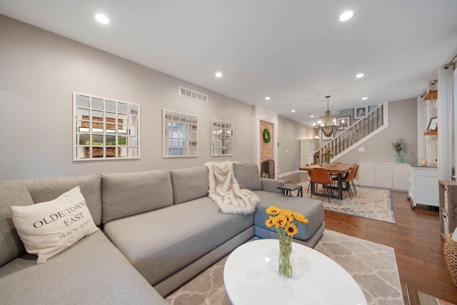 62 Sherman Ave, Columbus, OH 43205 - living area with recessed lighting, hardwood / wood-style flooring, stairs, and a chandelier