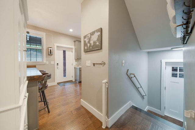 62 Sherman Ave, Columbus, OH 43205 - staircase with wood-type flooring, baseboards, and recessed lighting