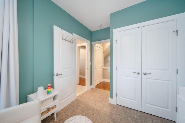 62 Sherman Ave, Columbus, OH 43205 - bedroom featuring baseboards, carpet, and a closet