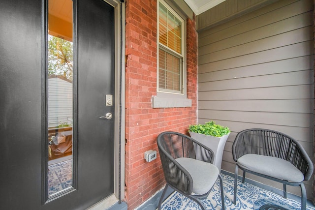 62 Sherman Ave, Columbus, OH 43205 - view of exterior entry featuring brick siding and a porch