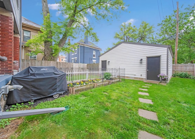 62 Sherman Ave, Columbus, OH 43205 - view of yard featuring a garden and an outbuilding