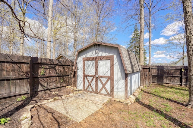 view of shed with a fenced backyard