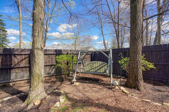 view of yard featuring fence and a gate
