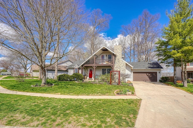 traditional home with an attached garage, a chimney, concrete driveway, a balcony, and a front lawn