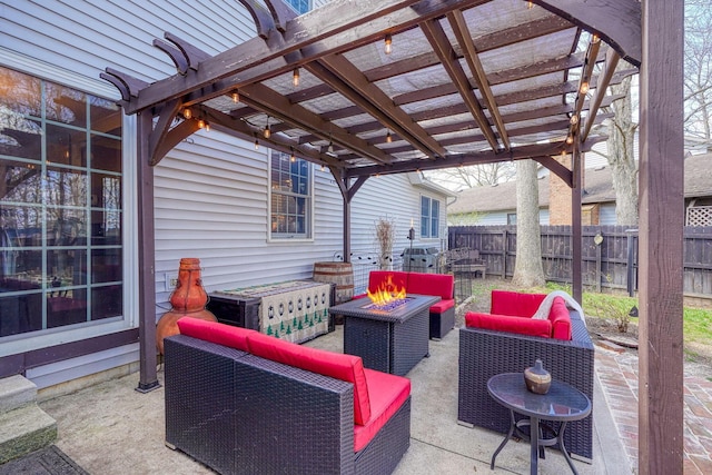 view of patio featuring an outdoor living space with a fire pit, a pergola, and fence