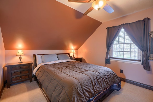 bedroom with a ceiling fan, carpet, and lofted ceiling