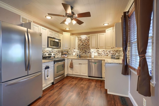 kitchen with crown molding, ceiling fan, dark wood-style flooring, stainless steel appliances, and decorative backsplash
