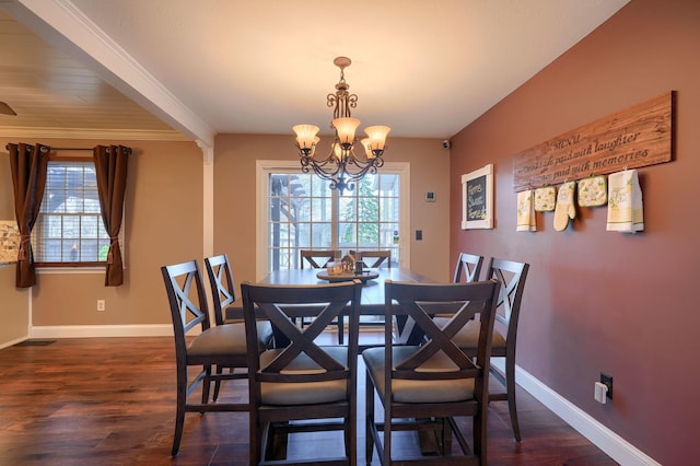 dining area with a chandelier, baseboards, dark wood finished floors, and plenty of natural light
