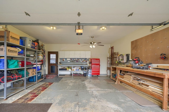 garage featuring a garage door opener, ceiling fan, and a workshop area