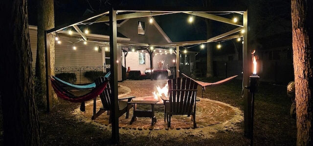 patio at night with a fire pit