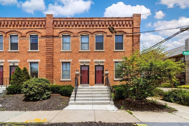 210 Warren St, Columbus, OH 43215 - view of front of house with brick siding