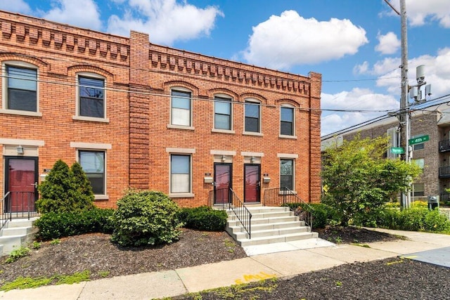 210 Warren St, Columbus, OH 43215 - view of front facade featuring brick siding