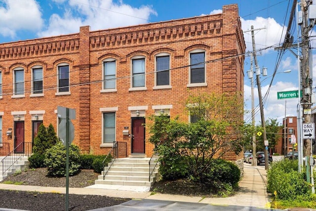 210 Warren St, Columbus, OH 43215 - view of front facade featuring brick siding