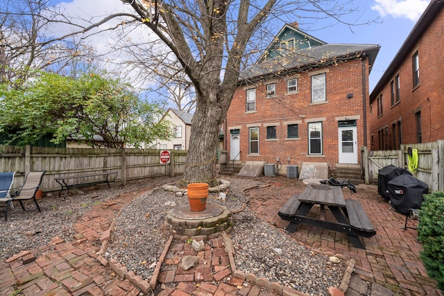 69-71 E 1st Ave, Columbus, OH 43201 - view of patio with entry steps, a fenced backyard, and central AC unit