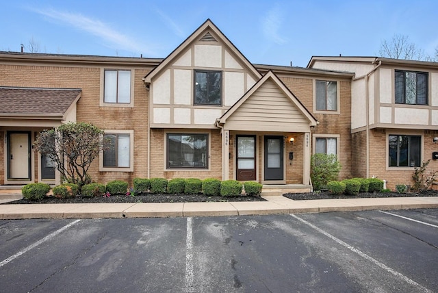 5696 Great Hall Ct, Columbus, OH 43231 - view of front of house with brick siding, stucco siding, and uncovered parking
