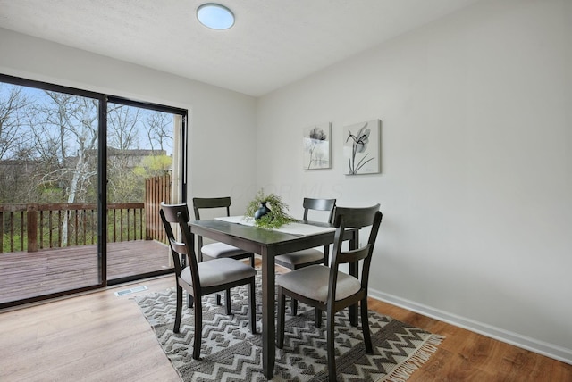 5696 Great Hall Ct, Columbus, OH 43231 - dining space with baseboards, visible vents, and wood finished floors