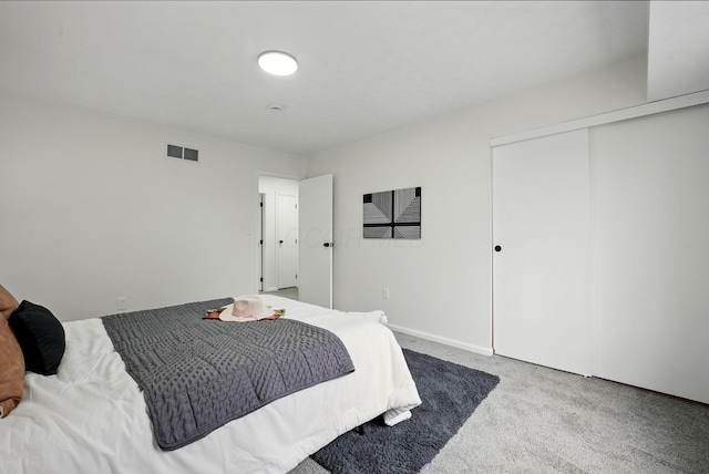 5696 Great Hall Ct, Columbus, OH 43231 - bedroom with baseboards, visible vents, a closet, and carpet flooring