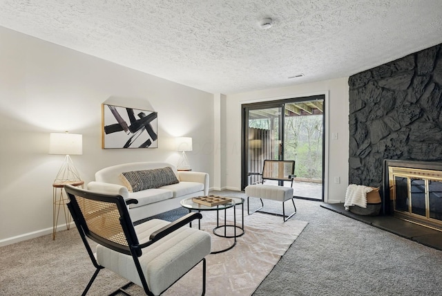 5696 Great Hall Ct, Columbus, OH 43231 - carpeted living room with visible vents, baseboards, a fireplace, and a textured ceiling