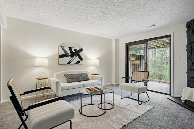 5696 Great Hall Ct, Columbus, OH 43231 - carpeted living area featuring baseboards, a textured ceiling, and visible vents