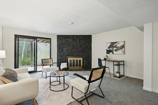 5696 Great Hall Ct, Columbus, OH 43231 - carpeted living room with a stone fireplace, baseboards, and a textured ceiling