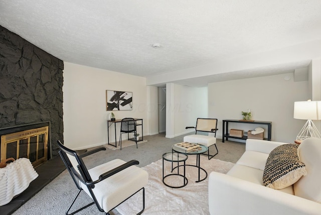 5696 Great Hall Ct, Columbus, OH 43231 - living area featuring baseboards, carpet floors, a textured ceiling, and a stone fireplace