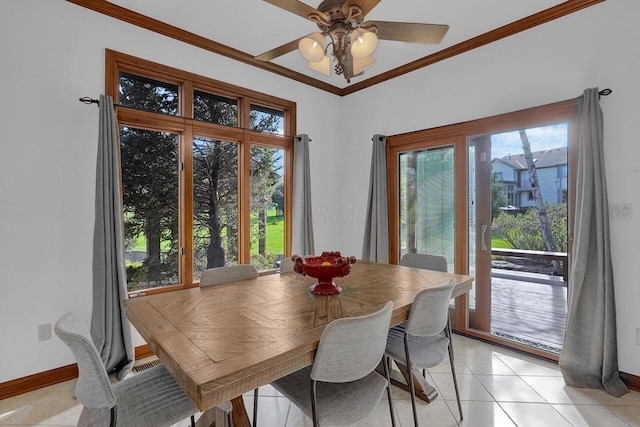 dining space featuring light tile patterned floors, ceiling fan, ornamental molding, and baseboards