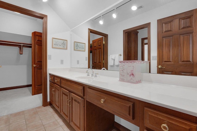 full bathroom with tile patterned floors and vanity