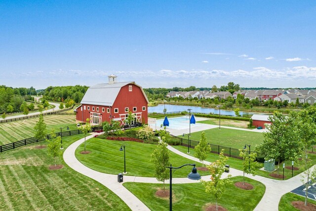 7711 Falcon Hill Ct, Plain City, OH 43064 - view of property's community featuring a yard, fence, an outdoor structure, a barn, and a water view