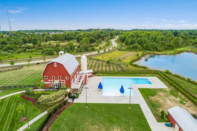 7711 Falcon Hill Ct, Plain City, OH 43064 - view of pool featuring a yard, fence, an outdoor structure, and a barn