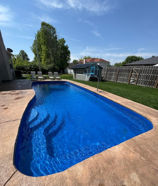 711 James Way, Marion, OH 43302 - view of pool featuring an outdoor structure, a patio area, and a shed