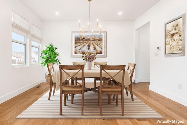 3805 Aviary Loop, Hilliard, OH 43026 - dining area featuring baseboards, recessed lighting, light wood-style floors, and a chandelier