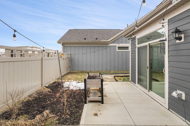 view of patio / terrace featuring a garden and a fenced backyard