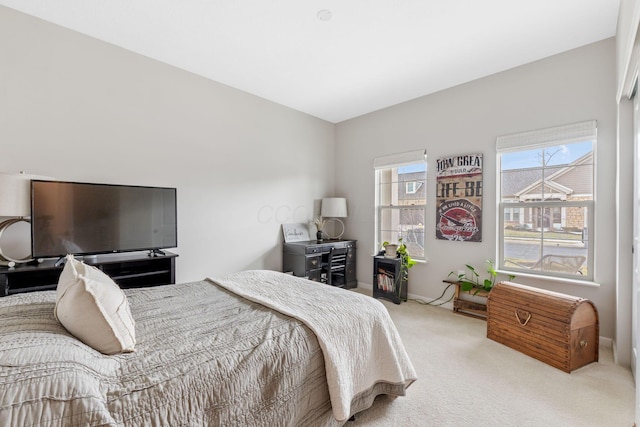 carpeted bedroom with baseboards