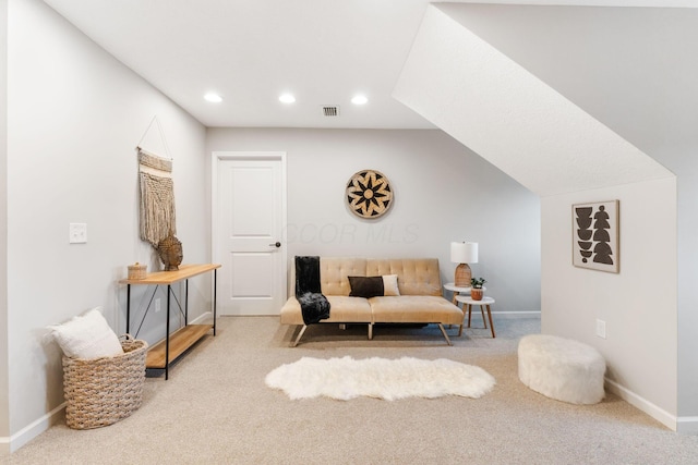 living area featuring baseboards, lofted ceiling, recessed lighting, and carpet