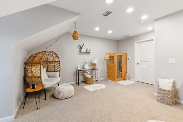 sitting room featuring visible vents, baseboards, recessed lighting, lofted ceiling, and carpet floors