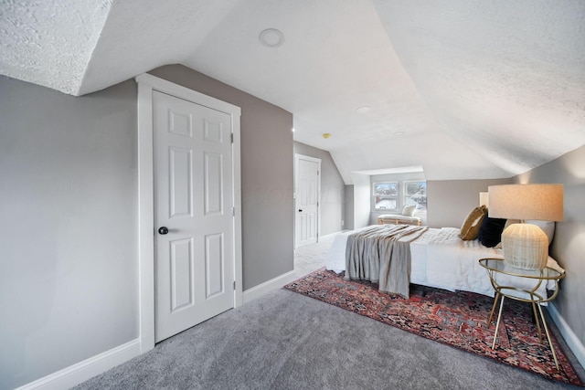 bedroom with baseboards and a textured ceiling