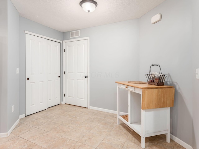6088 Sowerby Ln, Westerville, OH 43081 - unfurnished office featuring baseboards, a textured ceiling, and visible vents