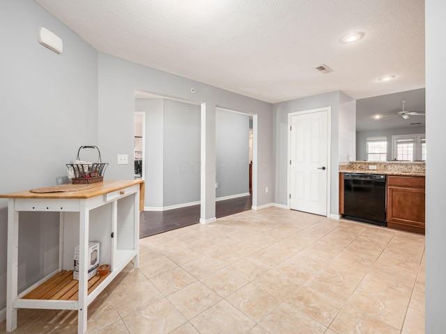 6088 Sowerby Ln, Westerville, OH 43081 - kitchen featuring a textured ceiling, visible vents, ceiling fan, black dishwasher, and brown cabinetry