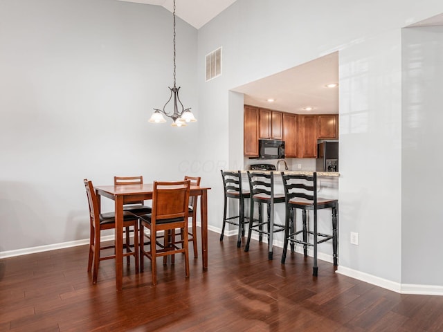 6088 Sowerby Ln, Westerville, OH 43081 - dining room with baseboards, visible vents, a chandelier, and dark wood finished floors