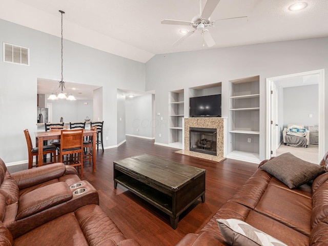 6088 Sowerby Ln, Westerville, OH 43081 - living room featuring built in features, visible vents, ceiling fan with notable chandelier, and wood finished floors