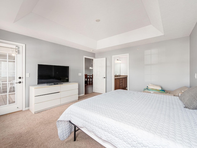 6088 Sowerby Ln, Westerville, OH 43081 - bedroom featuring baseboards, ensuite bath, light carpet, and a raised ceiling