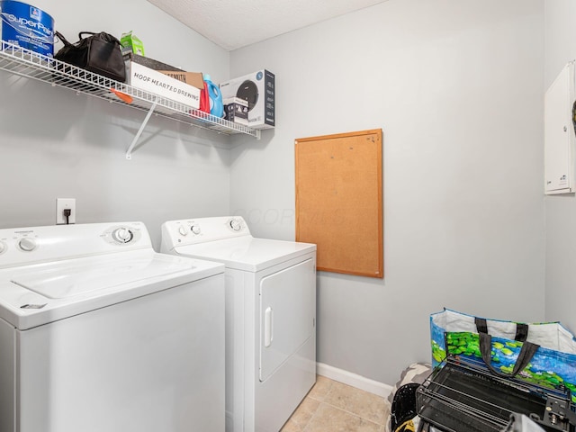 6088 Sowerby Ln, Westerville, OH 43081 - laundry area featuring light tile patterned flooring, independent washer and dryer, laundry area, and baseboards