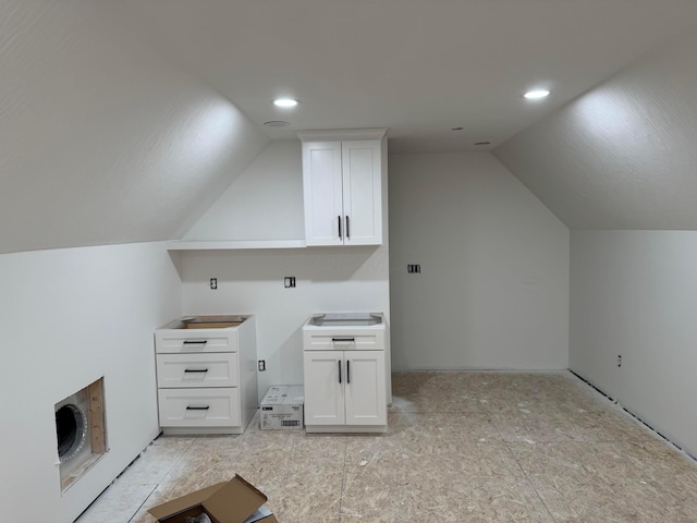 bonus room with heating unit, lofted ceiling, and recessed lighting
